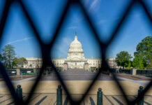 Pentagon Bombshell: Ally Tagged ‘Top Threat’ View of the U.S. Capitol building through a security fence