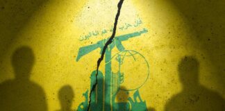 Silhouettes of two figures against a yellow background featuring Hezbollah's emblem
