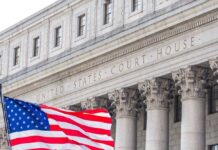High Court Slams Door — NYC Pushes Back Facade of a United States courthouse with an American flag in the foreground