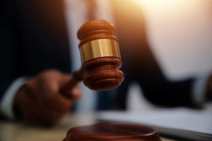 Law,Theme,,Gavel,Or,Mallet,Of,The,Judge,,Lawyer,Enforcement A judge's gavel being raised in a courtroom setting
