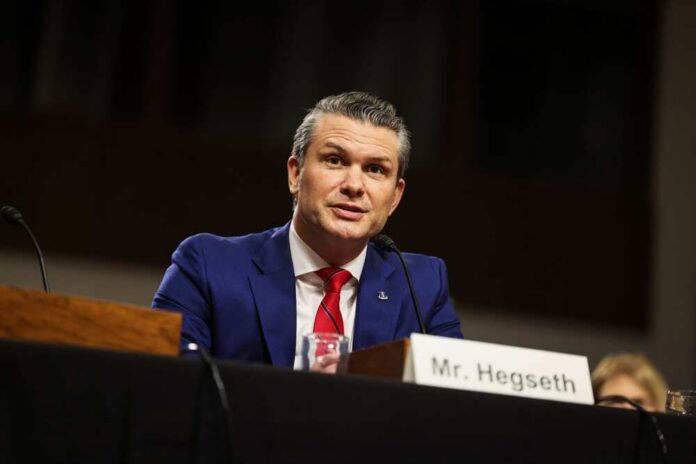 Washington,-,January,14,2025:,Pete,Hegseth,,Secretary,Of,Defense Man in a blue suit speaking at a government hearing