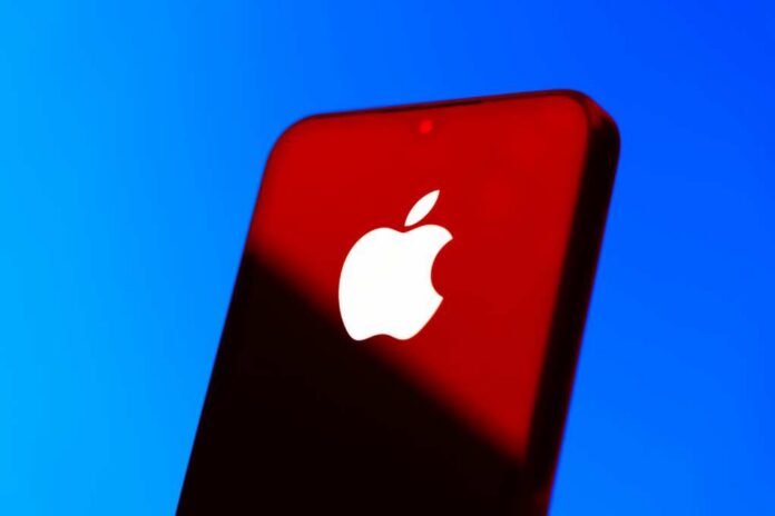 Prague,,Czechia,-,10,21,2024:,Smartphone,On,Surface,Showing Close-up of a smartphone with the Apple logo against a red and blue background