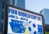 FIFA World Cup 26 poster with soccer ball in urban setting