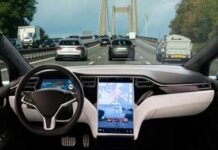 Car interior with large touchscreen showing navigation on a busy highway
