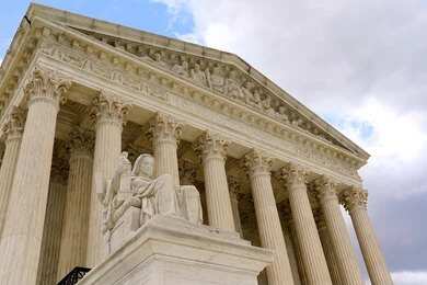 2173350561-1 Supreme Court building with columns and statue