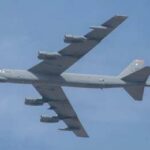 Dark Spy Plane Taunts NATO Skies Military bomber aircraft flying against a blue sky