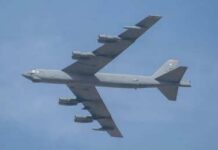 Dark Spy Plane Taunts NATO Skies Military bomber aircraft flying against a blue sky