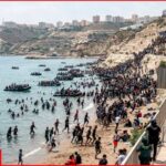 Crowd breaks through border from Spanish territory of Ceuta from Morocco