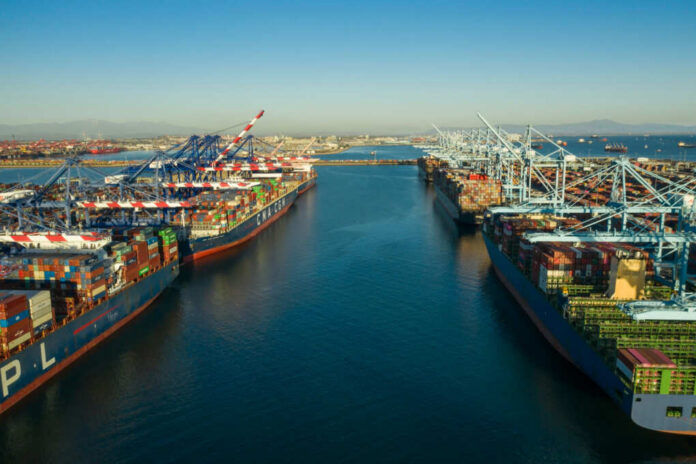 shutterstock1915485742jpg Aerial view of cargo ships docked at a shipping port