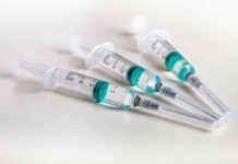 Cash For Needles Sparks NYC Uproar Three syringes filled with blue-green liquid on a white surface