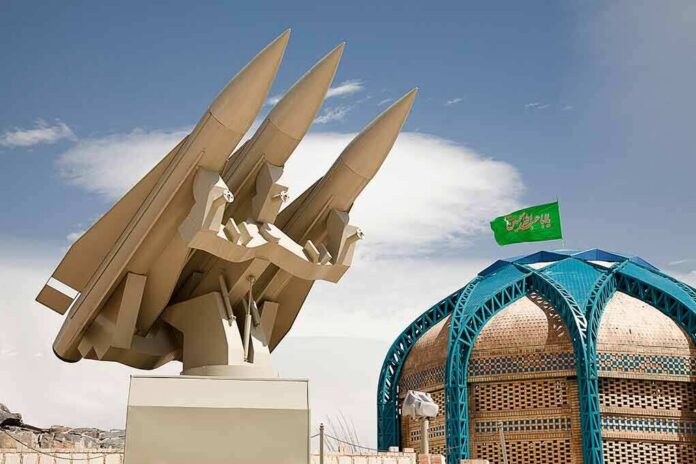 missile launcher beside domed building with green flag