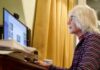 15,000 Donations—From One Widow? older woman using a desktop computer at a desk