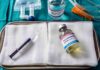 Euthanasia Twist: Diary Sparks Manhunt Medical tray with syringe and pentobarbital vials on gauze