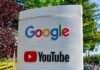 Google and YouTube logos on an outdoor office sign