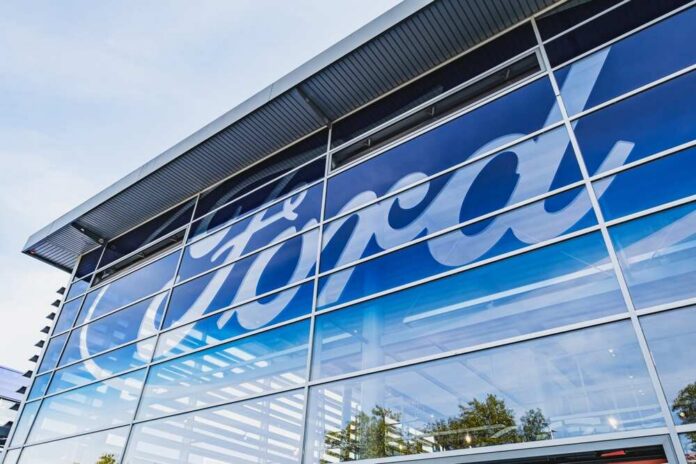 Dusseldorf,,Germany,-,September,22,2024:,Ford,Logo,On,The Exterior view of a Ford dealership with a large logo on the glass
