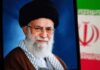 Forced Mourning? Iran’s Funeral Uproar Portrait of a political leader with a black turban and glasses