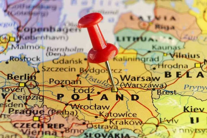 shutterstock_510294343 Red pushpin marking Poland on a European map