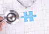 A stethoscope next to a puzzle piece labeled 'Medicaid'