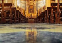 Church Crackdown Erupts After Explosive Pope Jab Church interior with wooden pews facing ornate altar