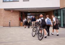 Religious Exemptions Trigger Voucher Showdown Students in uniforms arriving at a school entrance