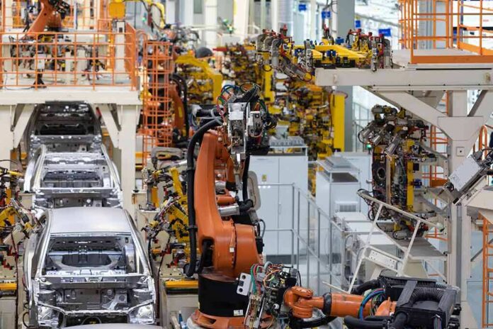 shutterstock_1251721840 Industrial robots assemble car bodies on an automotive production line