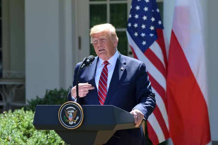shutterstock_1432764878 man at presidential podium speaking outdoors