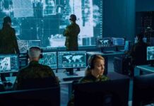 Iranian Hackers Black Out British Power Plant Military analysts monitor data on multiple screens in a command center