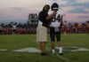Campus Cam Catches Coach’s Shocking Kick football coach with arm around player number 84 on sideline