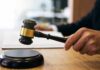 Midterm Maneuver: Abortion Pill Fight Stalled Judge's hand holding a gavel over a sound block