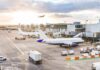 Runway Disaster FREEZES Miami Flights Airplanes at airport gates during sunset with ground vehicles and jet bridges