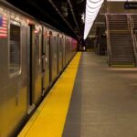 Subway train at an empty underground platform