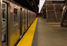 Subway train at an empty underground platform