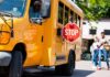 Bus Stop Standoff Sparks Florida Firestorm School bus with extended stop sign near students on sidewalk