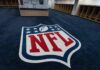 NFL logo on the floor of an empty locker room