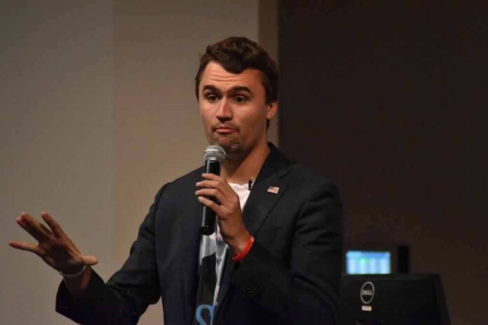 shutterstock_1232506888 man speaking into a microphone during a talk