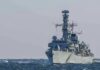 Hormuz Flashpoint: U.S. Hits Iranian Tankers naval warship sailing on rough sea