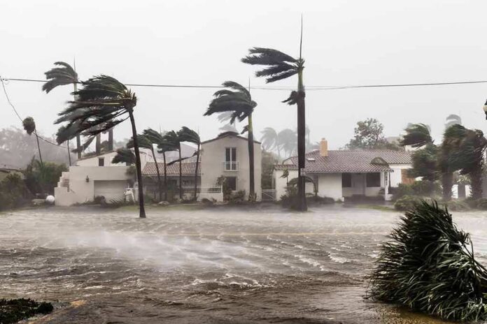 shutterstock_1256683165 Houses battered by hurricane winds and flooding