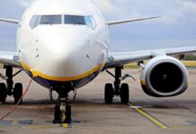 Passenger jet parked on tarmac front view