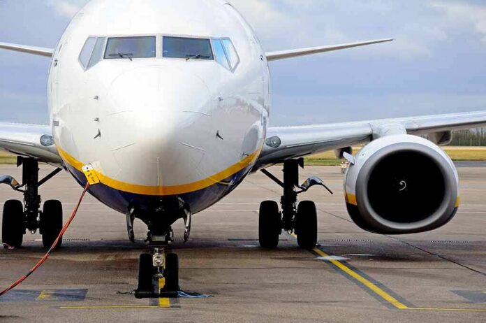 shutterstock_133793786 Passenger jet parked on tarmac front view
