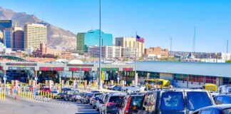 Cars lined up at a border crossing checkpoint
