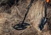 Backyard Bang Reveals Viking Fortune Metal detector and shovel in dry grass