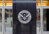 U.S. Department of Homeland Security emblem on building entrance