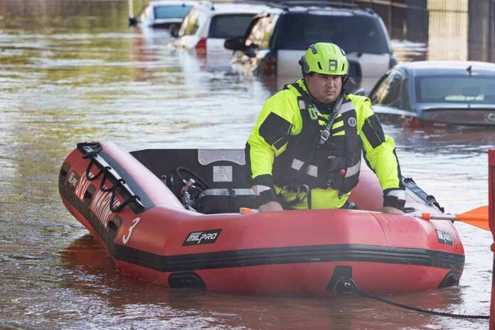 Rescue worker in an inflatable boat during urban flooding