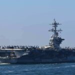 Aircraft carrier cruising at sea