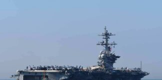 Aircraft carrier cruising at sea