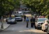 Midnight Ambush Rocks Cape Town Police officers secure a residential street with patrol cars and yellow tape