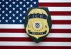 Fugitive Trucker Nabbed In Routine Stop ICE officer badge on American flag background
