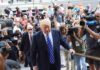 Russia-Linked Wedding Tab Sparks Fury Donald Trump walks up steps through a crowd as A. J. Calloway films nearby