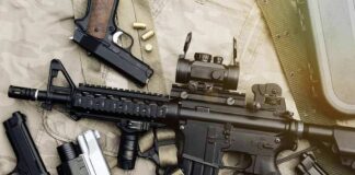 Assault rifle and handguns on tactical gear