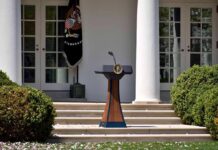 Roger Clemens Honor Sparks Firestorm Podium with presidential seal in a garden colonnade